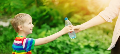 Person with water bottle outdoors