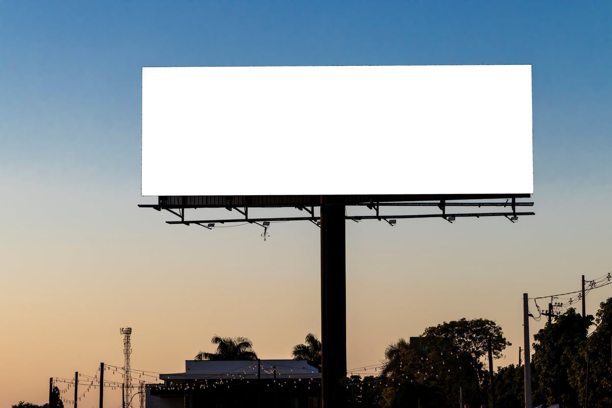 Empty billboard in middle of nowhere with no audience