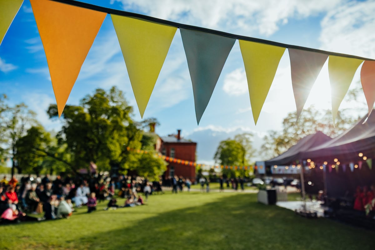 Lively outdoor festival with people gathering and community celebration