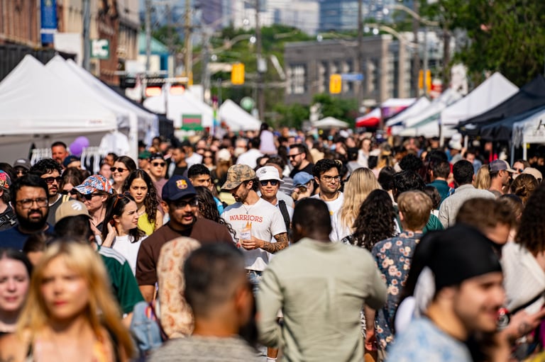 Community festival with crowds gathering outdoors