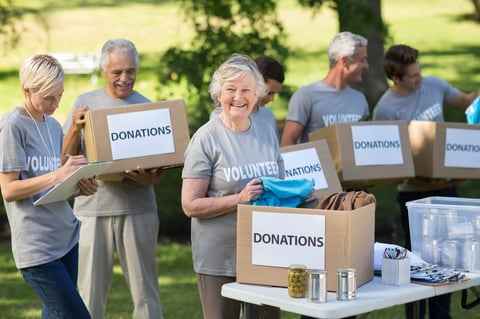 Happy family holding donation boxes